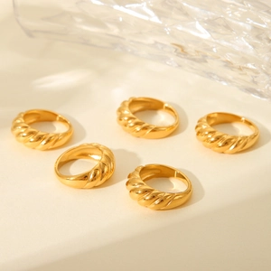 Golden croissant dome rings set in stainless steel for women with textured twisted design