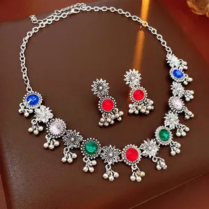 Vintage bohemian jewelry set with multicolor rhinestones and floral tassel details