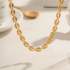 Elegant 18k gold plated stainless steel coffee bean link necklace on soft fabric