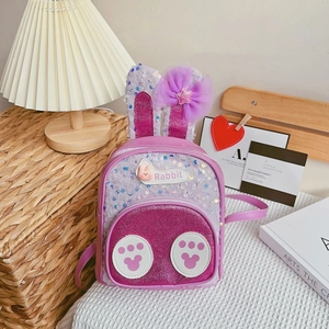 Detail of purple sequin rabbit backpack with sparkling bunny ears and mesh bow decoration