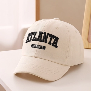 Detail shot of Atlanta Georgia 3D embroidery on cream cotton baseball cap for kids