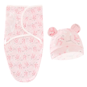 Detail of pink newborn swaddle wrap and matching rabbit ear hat with soft cartoon pattern