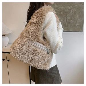 Close-up of khaki faux fur tote bag showing side zipper pocket and soft plush texture