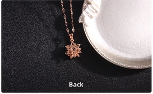 Macro shot showing the hollow back structure of the rose gold star pendant and chain