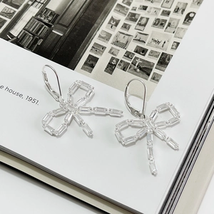 Elegant 925 sterling silver bow earrings with baguette-cut zircons and leverback hooks