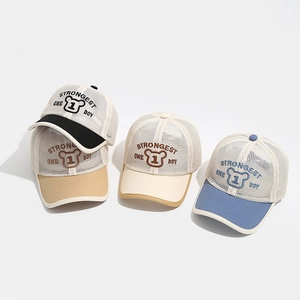 Detail showing four breathable mesh baseball caps for kids with bear embroidery patterns