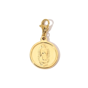 Detail of gold tree of life pendant with religious relief and lobster clasp charm