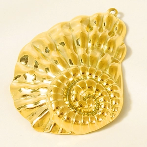 Macro shot of gold-plated 304 stainless steel nautilus shell pendant with 18K gold texture