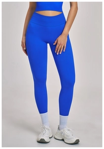 Detail of high-waisted seamless yoga pants featuring a wide ribbed tummy control waistband