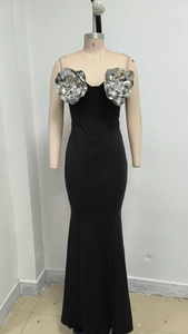 Detail of silver 3D floral accents on a black strapless mermaid evening gown