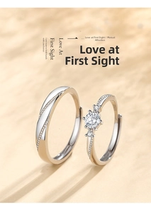 Detail of S925 sterling silver couple rings showing S925 hallmark and diamond setting
