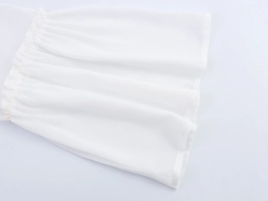Detailed view of elegant white chiffon bell sleeves with ruffled lace trim