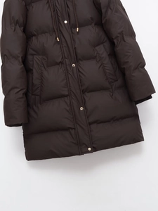 Detail of dark brown quilted hooded coat with metallic gold snap buttons and drawstrings
