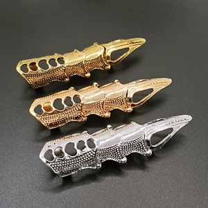 Detailed close-up of retro punk style long joint rings in gold, rose gold and silver finish