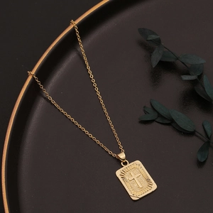 Gold rectangular cross pendant necklace with sunburst texture on a minimalist chain