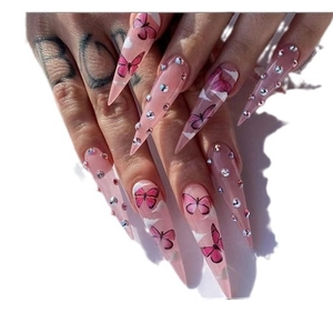 Long stiletto press on nails in pink with butterfly patterns and clear rhinestones