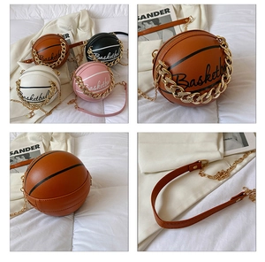 Detail of creative basketball-shaped crossbody bags in leather with metal chain straps