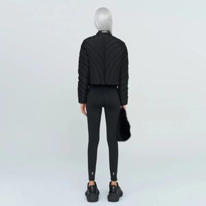 Back view of black slim fit high-stretch sports leggings and short down jacket outfit
