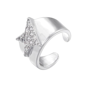 Macro shot of silver open ring featuring a sparkling zircon star and polished finish