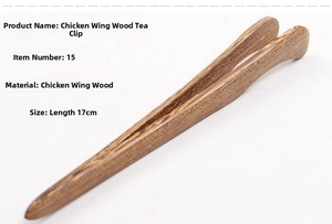 Detail view of 17cm Wenge wood tea tweezers with natural feather grain texture