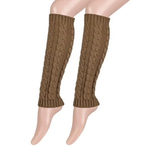 Close-up of thick cable knit leg warmers in dark brown featuring a textured twist pattern