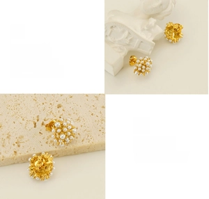 Detail of 18k gold vintage pearl cluster earrings with polished finish and fine texture