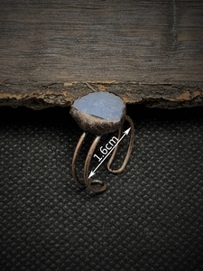 Macro detail of vintage adjustable open ring with irregular blue stone and 1.6cm size scale