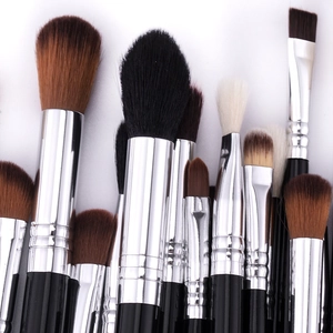 Close-up of 19pcs professional makeup brush set with synthetic fibers and silver ferrule