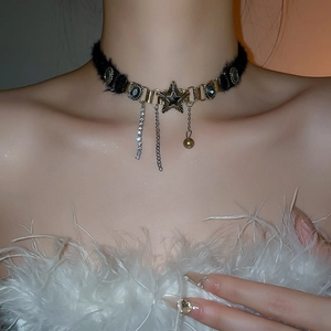 Detail of plush star choker necklace with hanging fringe chains and rhinestones