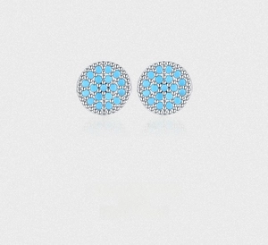 Macro shot of S925 silver stud earrings with turquoise stones and beaded edge