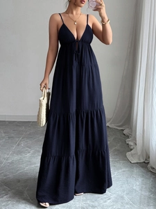 Detail of elegant navy blue tiered maxi dress featuring a V-neck and sleeveless design