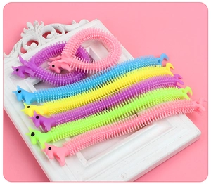 Close-up of colorful unicorn TPR stretchy fidget toys in various vibrant pastel shades