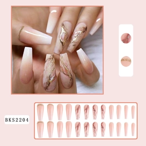 Detail of nude pink gradient and marble long trapezoid press-on nails with gold lines