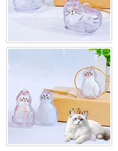 Macro detail of cat-shaped clear capsule keychain for pet hair storage with gold wire lock