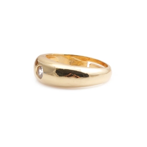 Fashionable gold plated ring featuring a central round sparkling zircon on white background