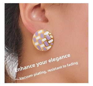 Detail showing checkered purple and white enamel stud earring on ear with gold plating