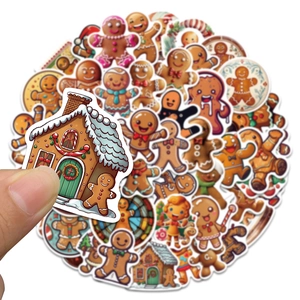 Close-up of waterproof Christmas gingerbread man stickers held in hand for scale
