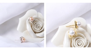Detail of square silver earrings with lustrous pink and white natural freshwater pearls