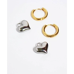 Vintage gold hoop earrings with silver heart pendants on a clean white background