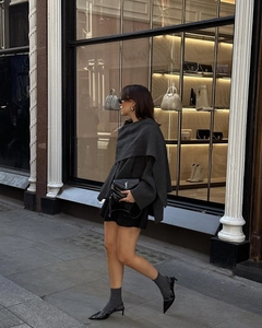 Chic dark grey knitted poncho cape for women featuring a wrap-style asymmetrical design