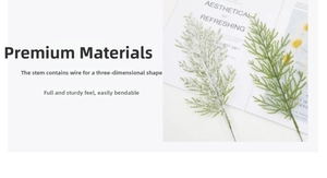 Close-up of artificial pine branches with flexible wire stems and snowy flocked needles