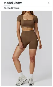 Detailed texture of seamless cocoa brown yoga set with high-waist shorts and crop top