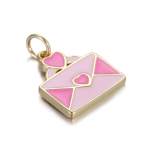 Macro shot of a golden envelope pendant with pink enamel hearts and a metallic clasp ring