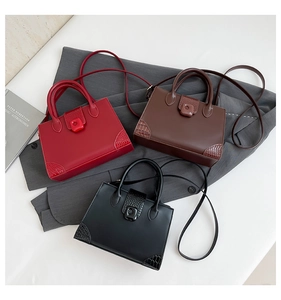 Detailed view of fashionable PU leather crossbody bags in red, brown, and black colors