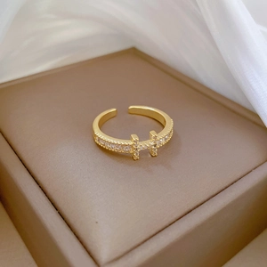 Adjustable gold H-shaped open ring with full zircon stones on a silk display