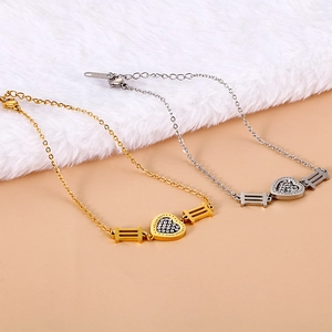 Minimalist heart pendant bracelet in gold and silver finish with rhinestone detailing