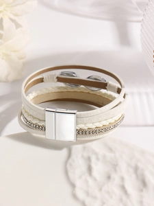 Close-up of bohemian multilayer leather bracelet with rhinestones and magnetic silver clasp