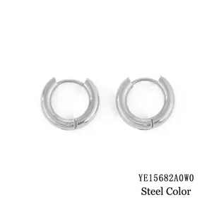 Macro view of polished steel hoop earrings with secure snap closure in silver finish