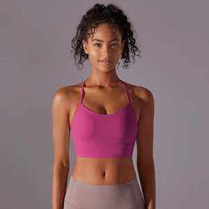 Detailed back view of pink racerback sports bra with supportive wide band and thin straps