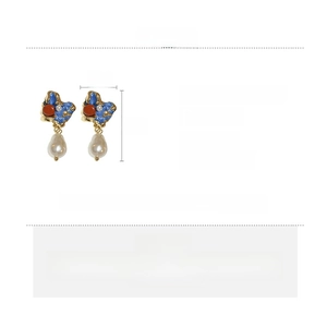 Detail view of vintage pearl earrings with blue enamel inlay and exact size measurements